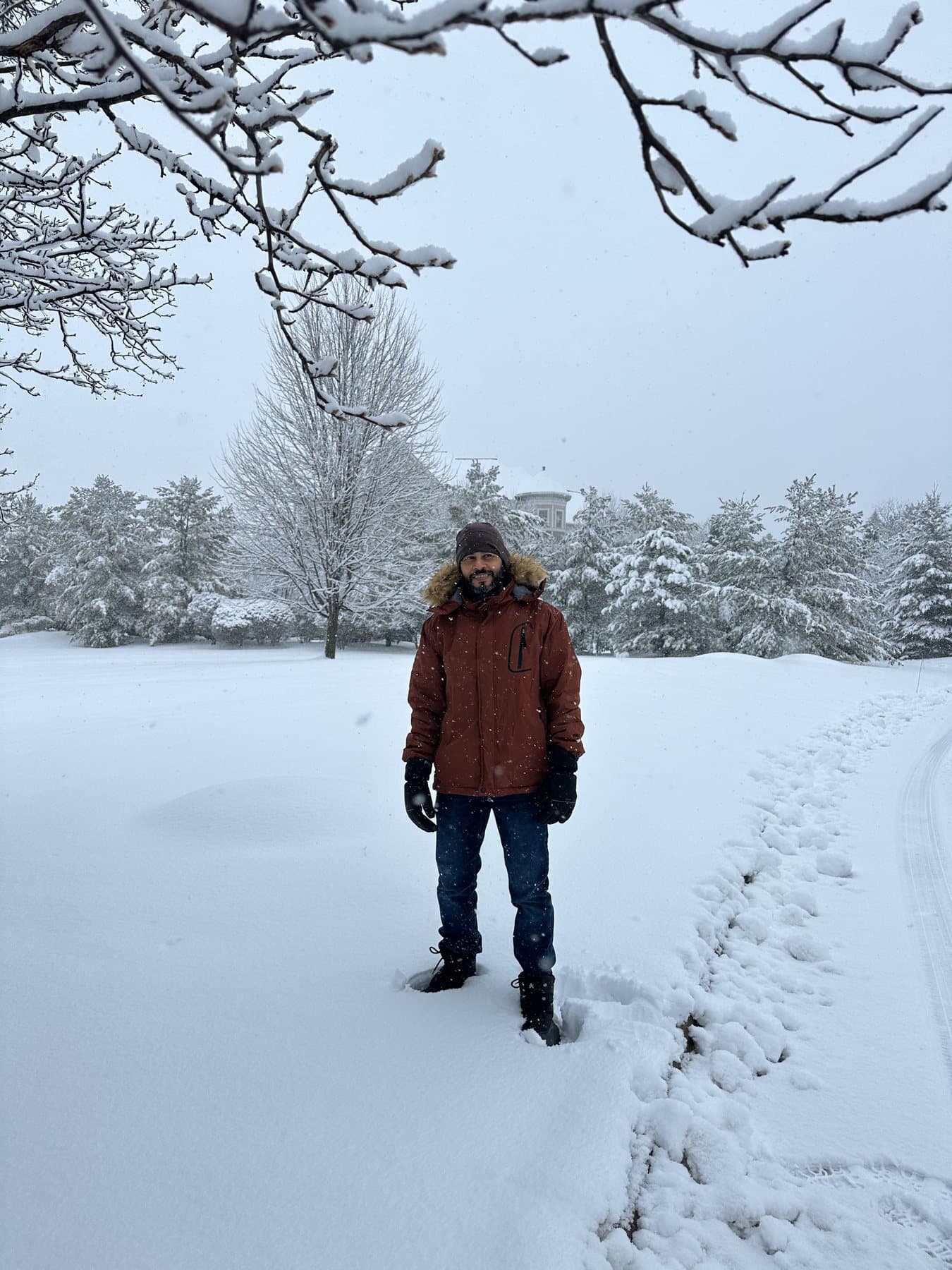 Prof. Manojit Ghosh standing in a snow-covered landscape